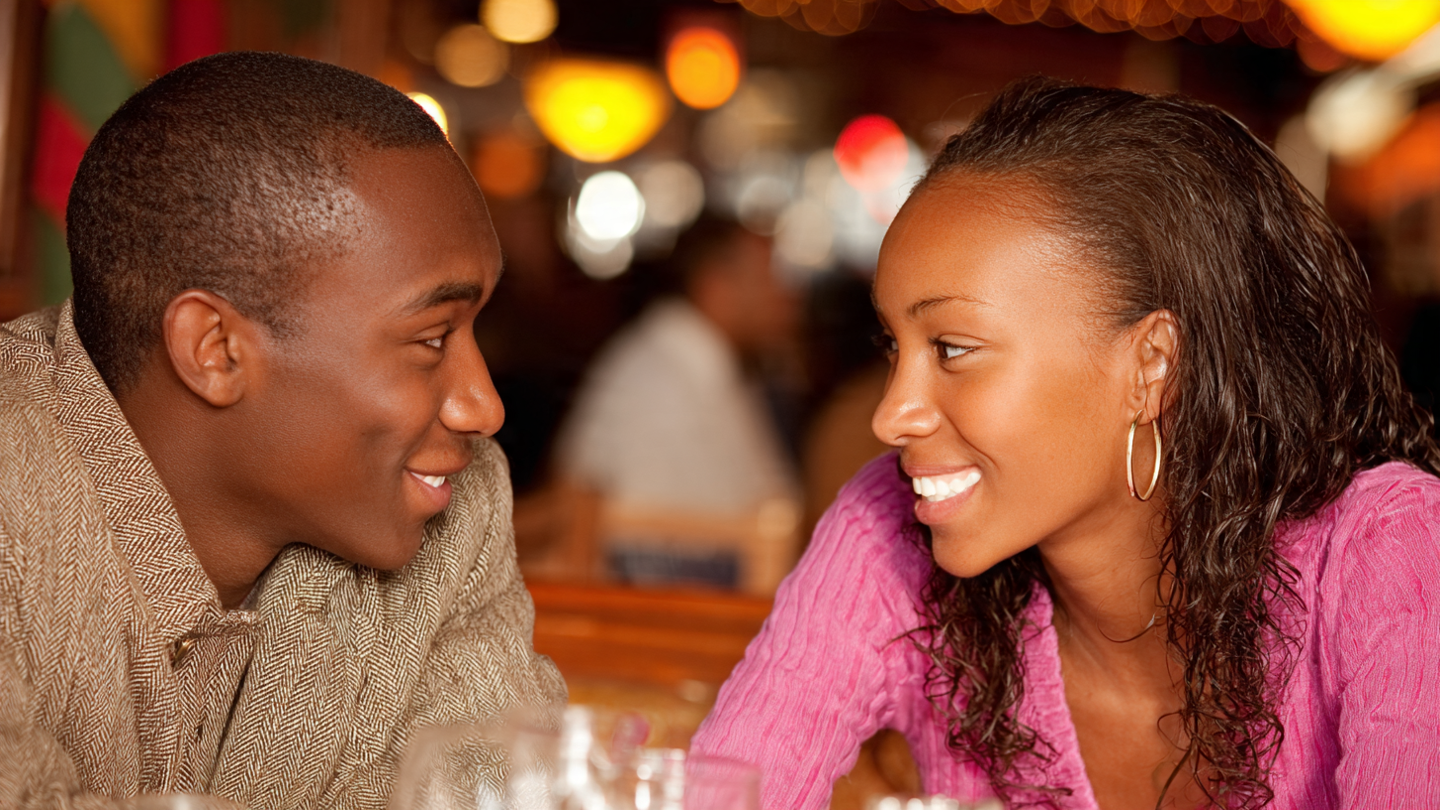 Confident couple laughing in a bar